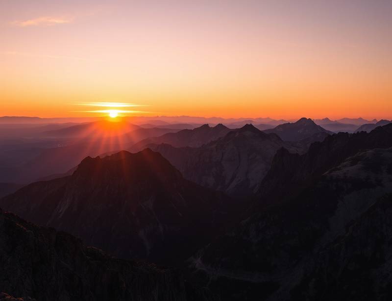 Stunning mountain range during sunset, a landscape photography scene.